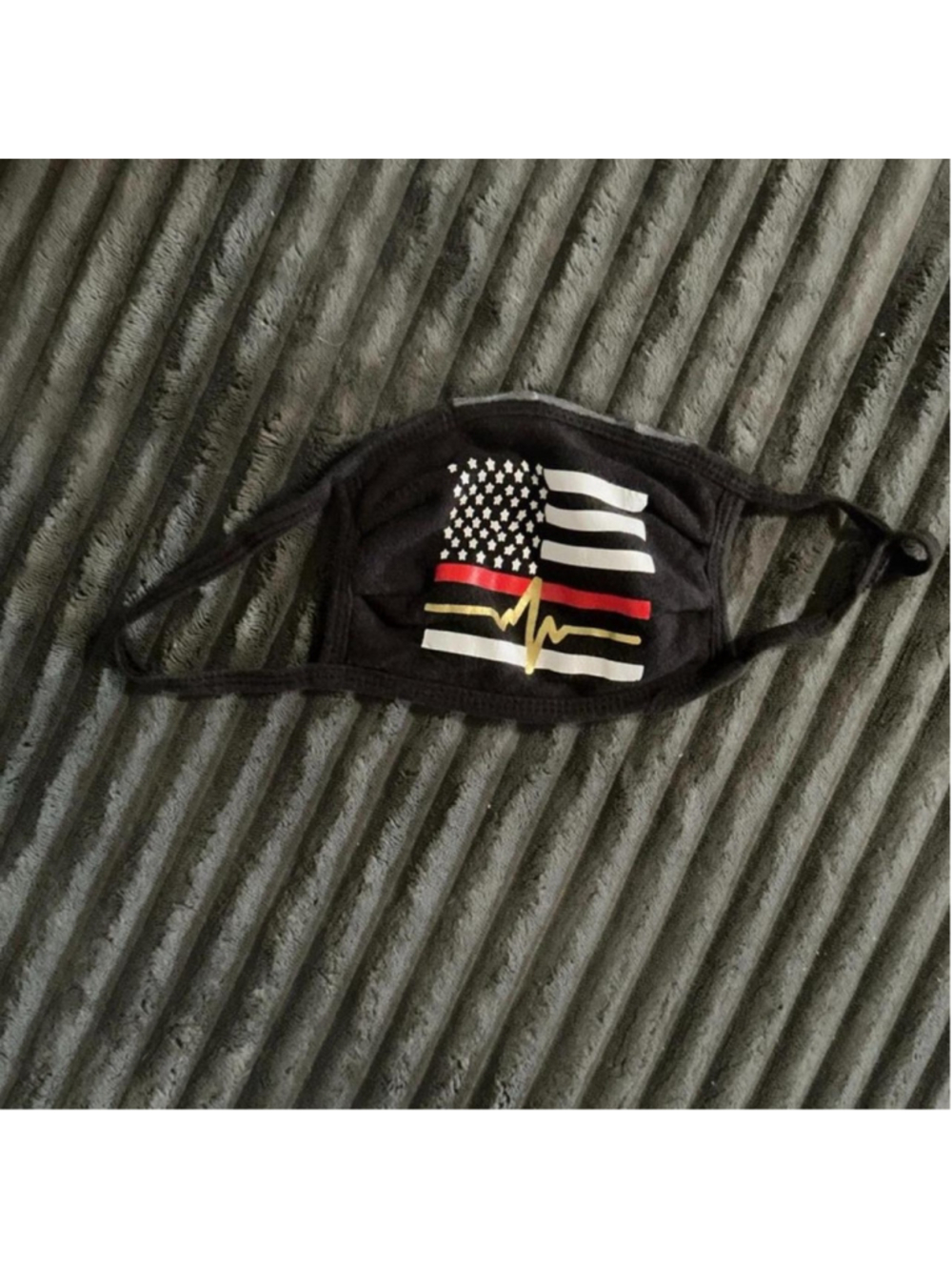 (434) Black face mask with white stripes, red line, and gold heartbeat graphic #